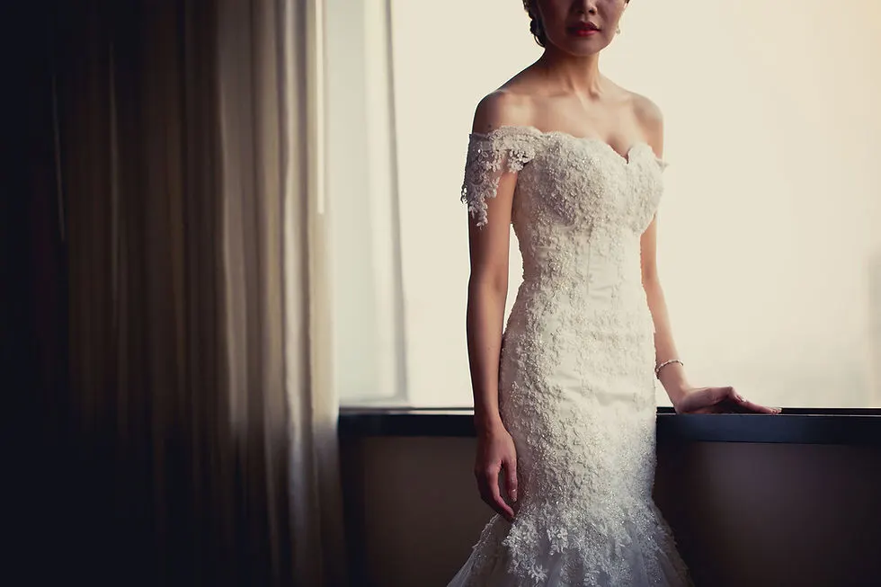 Bride Standing by Window