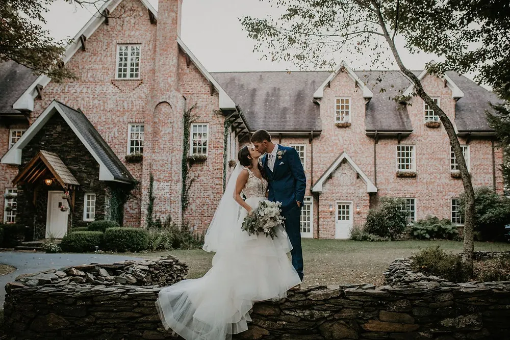 Bride and Groom Kissing Outside