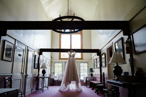 Wedding Dress Hanging from Rafter 