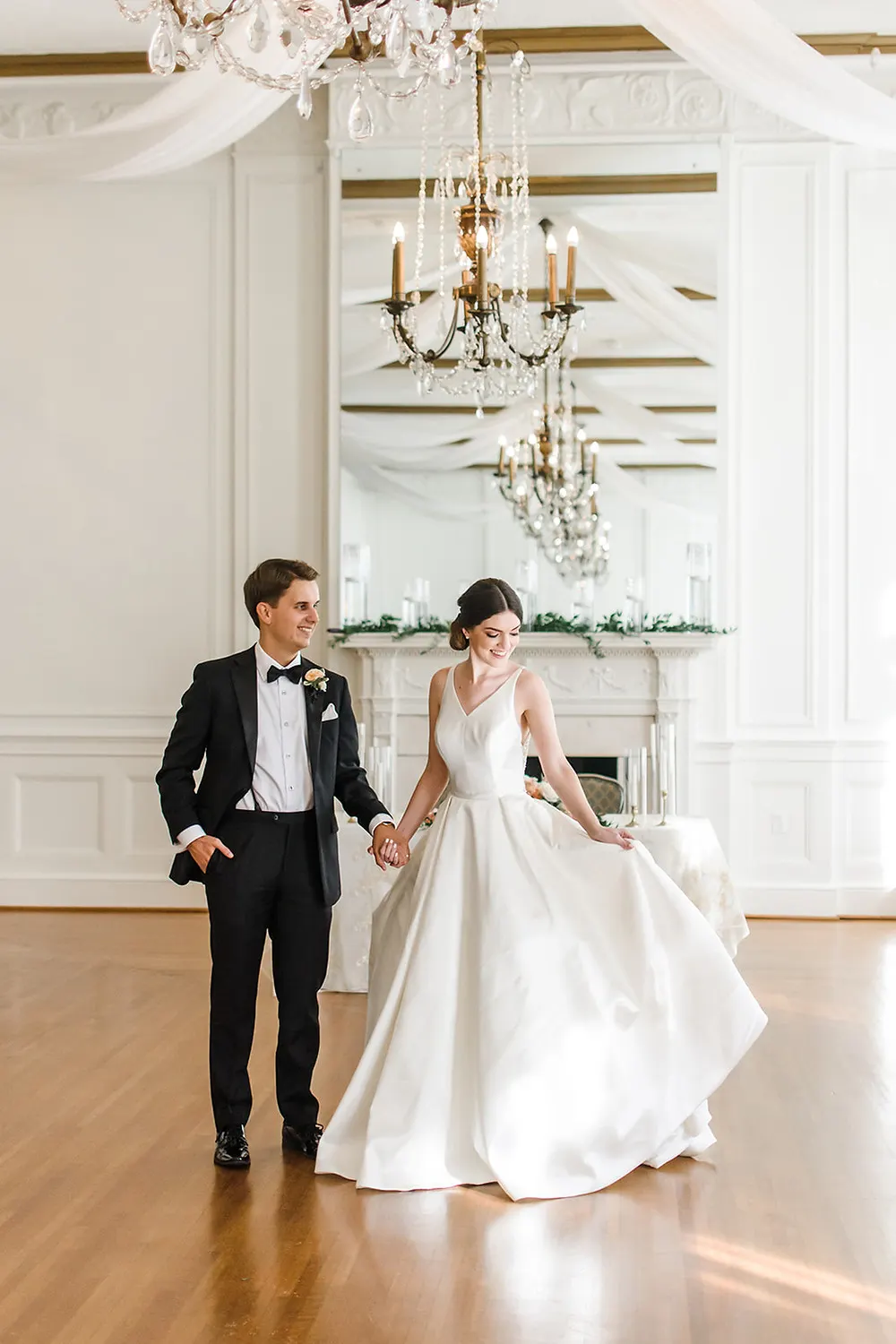 Bride and Groom in Front of Fireplace in Historic Hotel Building