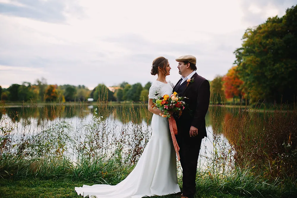 Bride and Groom in front of lake