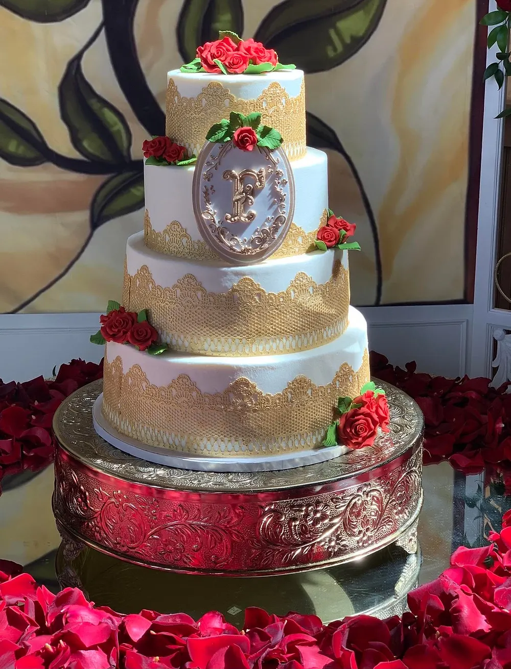 Red, White and Gold Wedding Cake Decorated