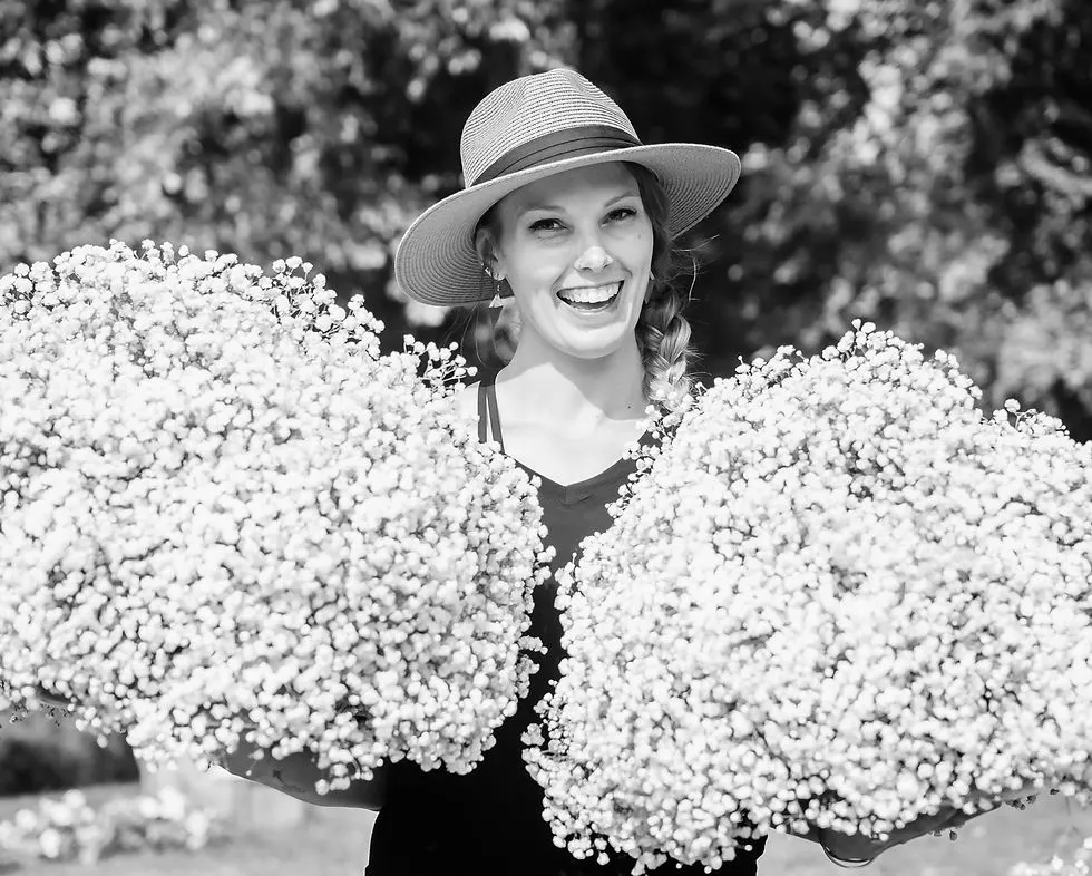 Owner Holding Flowers