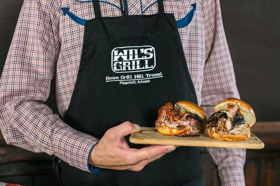 Chef Holding Sandwich Board